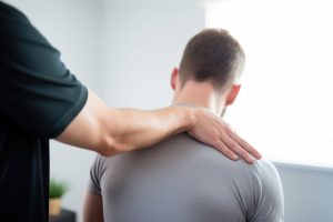 Chiropractor patient adult exercising.